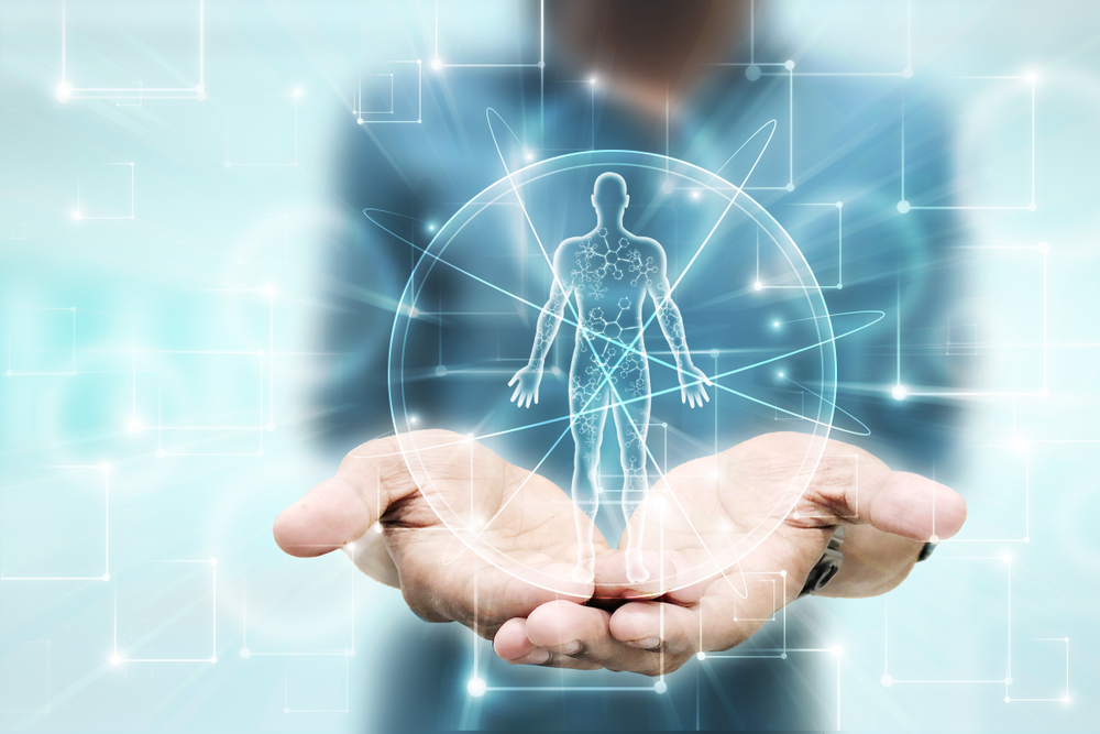 physiology of body in graphic held in man's hands