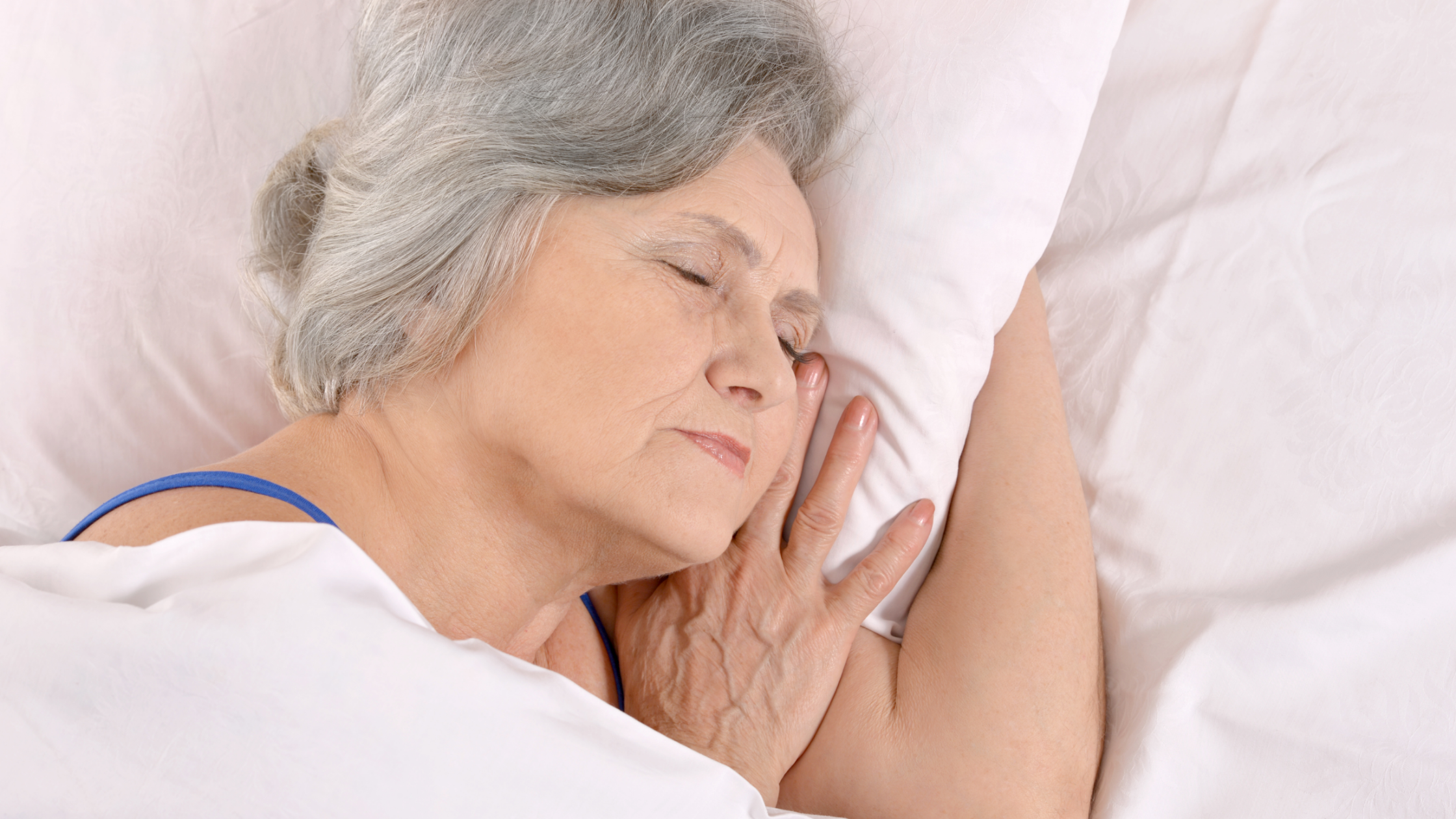older woman sleeping to manage chronic pain